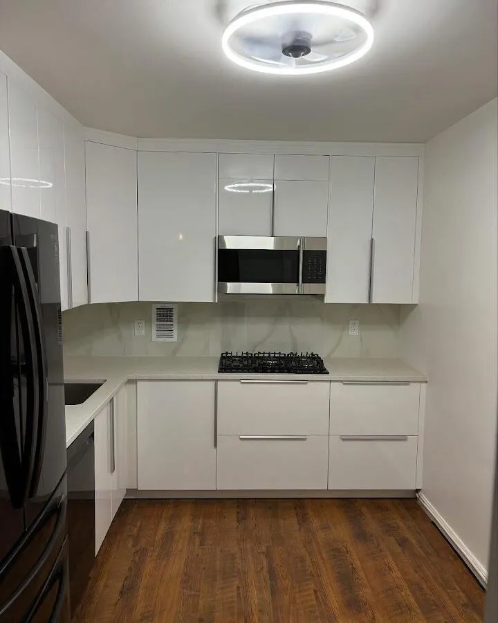 Renovated kitchen with quartz countertops in Hollis